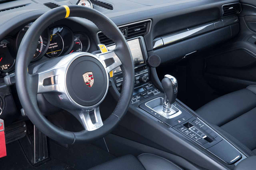 Porsche interior with Rennline magnetic phone mount installed.