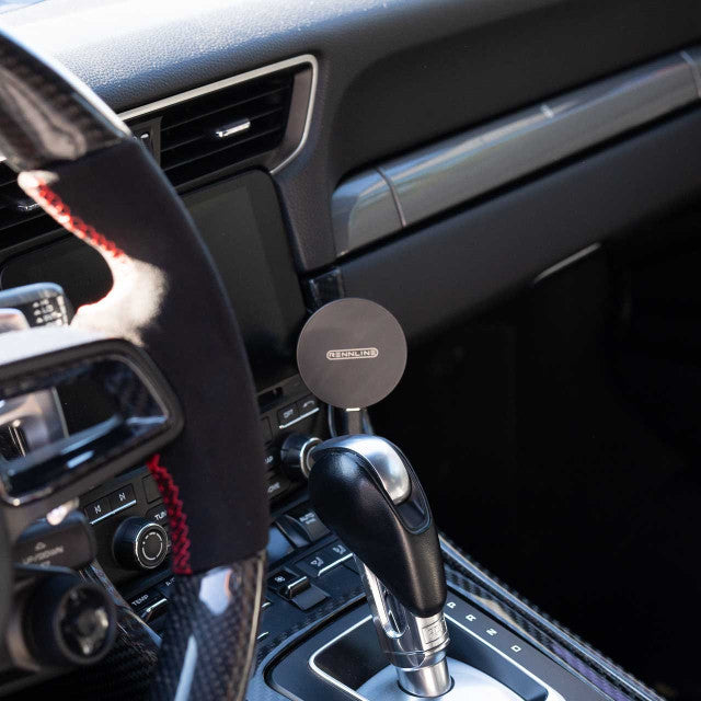 Porsche interior with Rennline magnetic wireless charger kit installed.