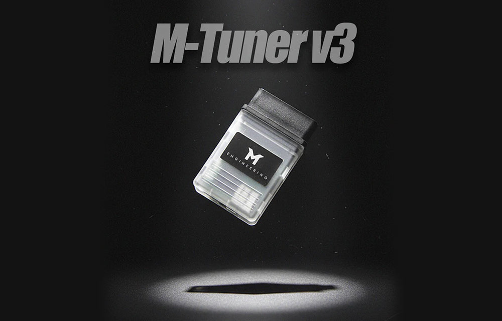 M-Engineering M-Tuner v3 dongle on a dark background